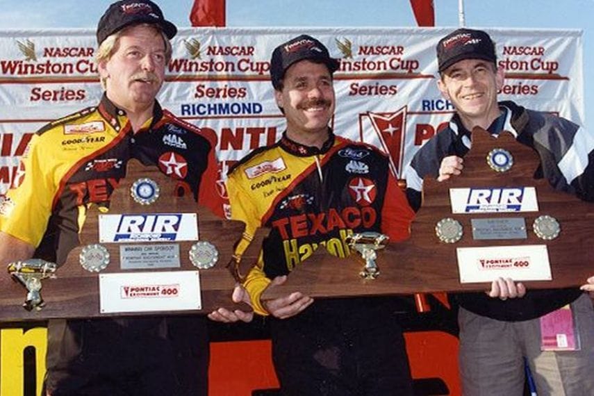 Ernie Irvan and Team Owner Robert Yates aech hold a trophy after winning the Pontiac Excitement 400 at Richmond